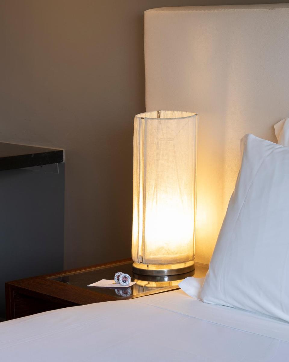 Uma cama ou camas num quarto em Hotel Rali Viana