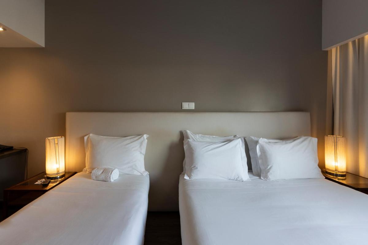 Uma cama ou camas num quarto em Hotel Rali Viana