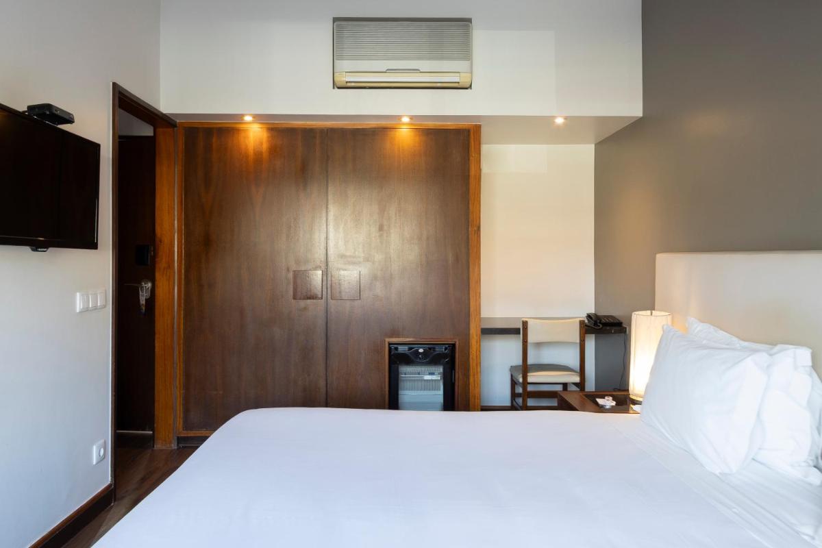 Uma cama ou camas num quarto em Hotel Rali Viana