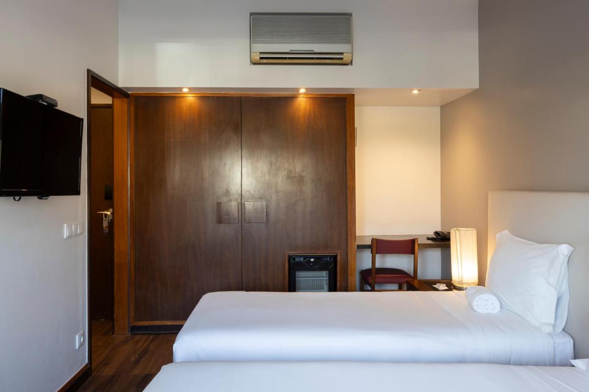 Uma cama ou camas num quarto em Hotel Rali Viana