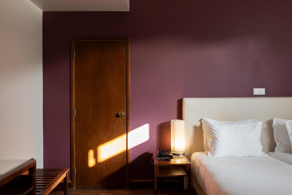 Uma cama ou camas num quarto em Hotel Rali Viana