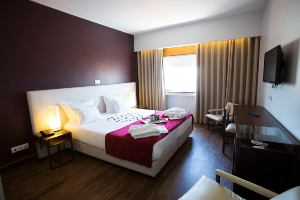 Uma cama ou camas num quarto em Hotel Rali Viana