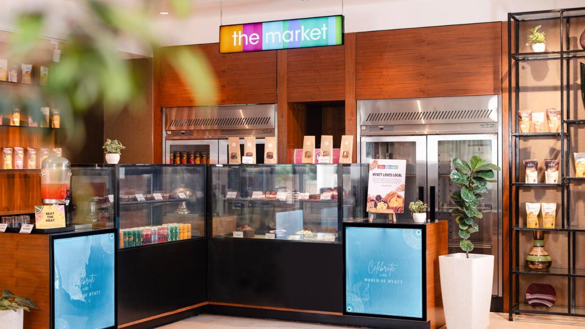a store front of a market with products in it at Hyatt Place Pune Hinjawadi in Pune