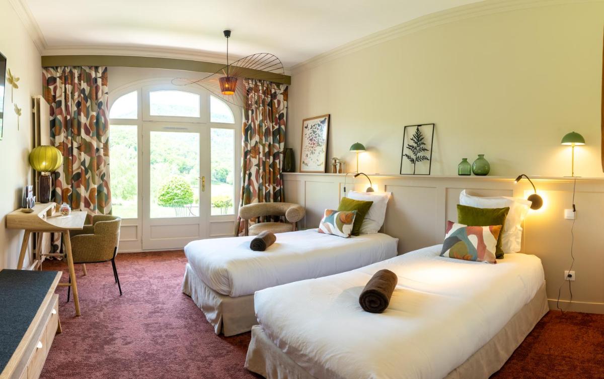 Un ou plusieurs lits dans un hébergement de l'établissement Le Domaine de Falgos Golf & Spa