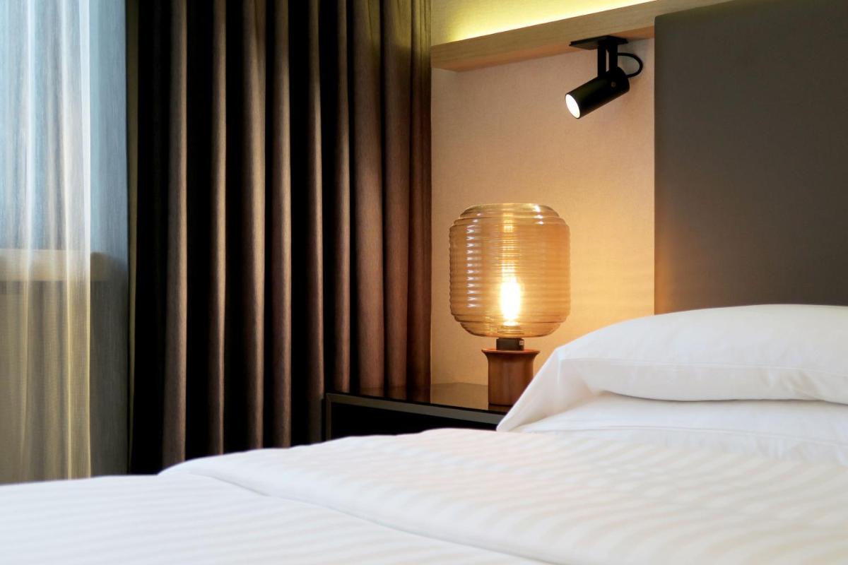 Ein Bett oder Betten in einem Zimmer der Unterkunft Frankfurt Airport Marriott Hotel Ein Bett oder Betten in einem Zimmer der Unterkunft Frankfurt Airport Marriott Hotel