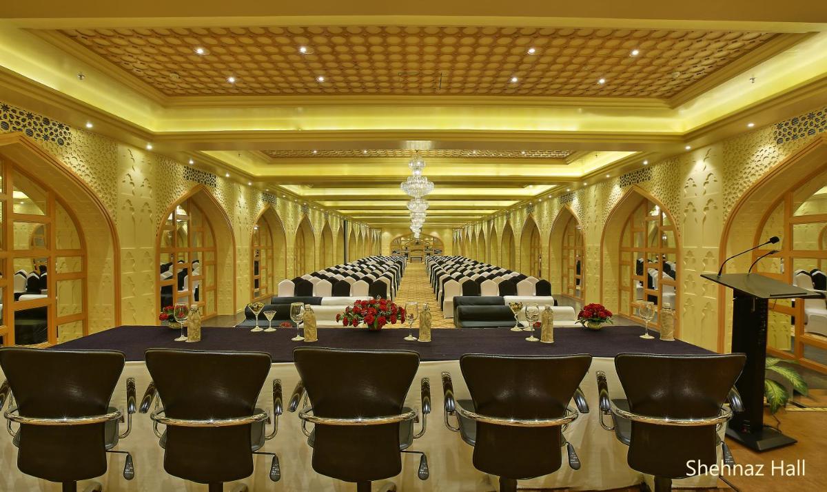 a large room with a long table and chairs at Hotel Clarks Shiraz in Agra +41 photos