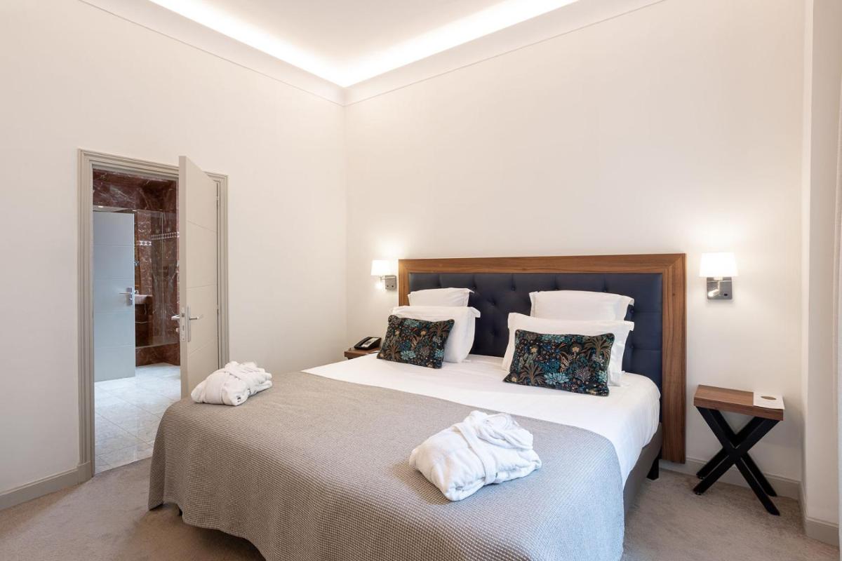 Un ou plusieurs lits dans un hébergement de l'établissement Westminster Hotel & Spa Nice