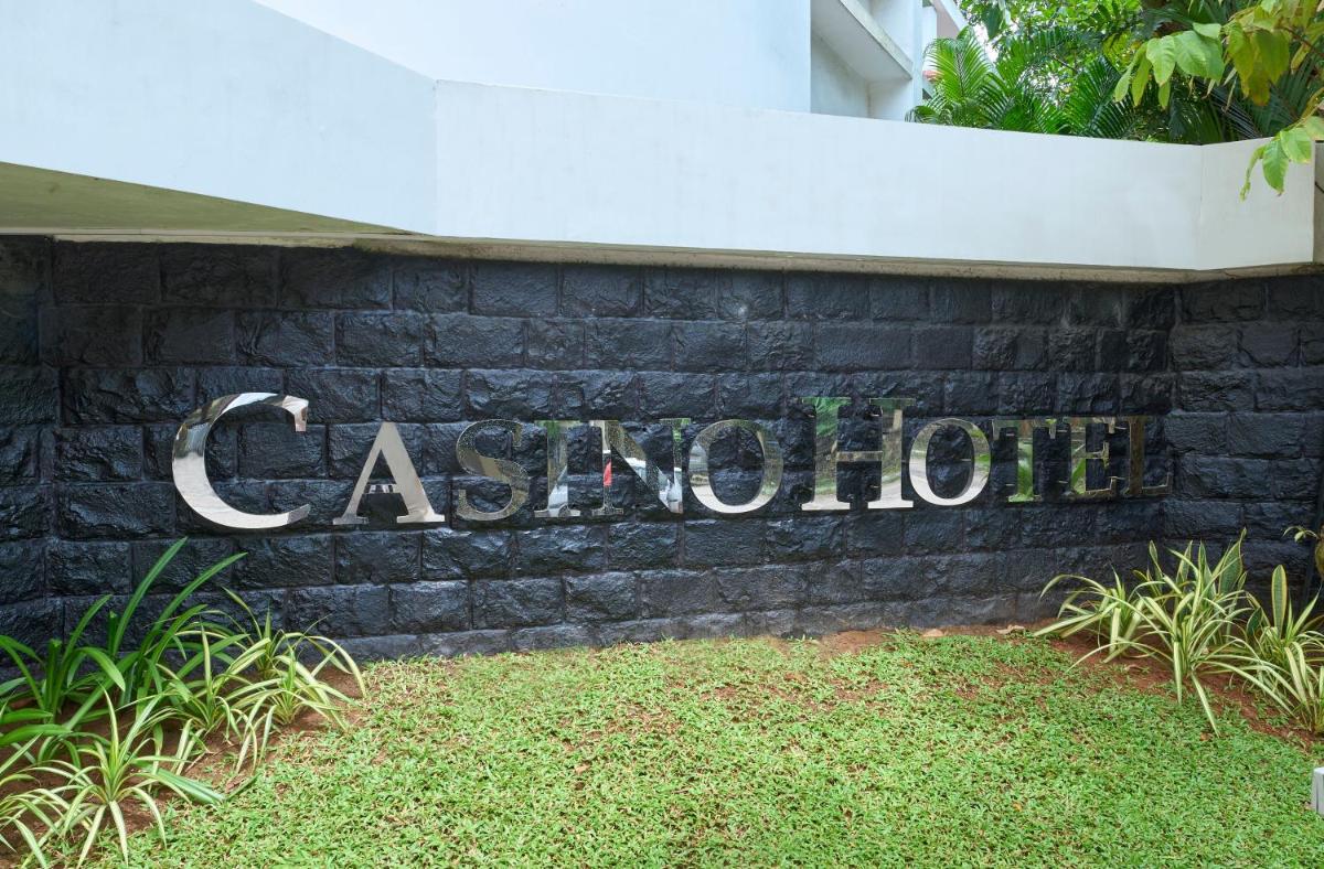 a sign for a building that says catepillar at Casino Hotel - CGH Earth, Cochin in Cochin