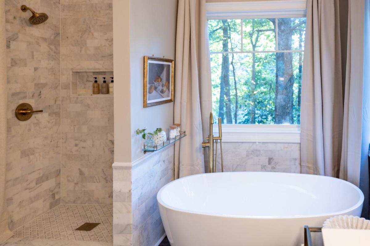 Sink into the Luxe Corner Tub at an Upscale, Spacious Home - Housity