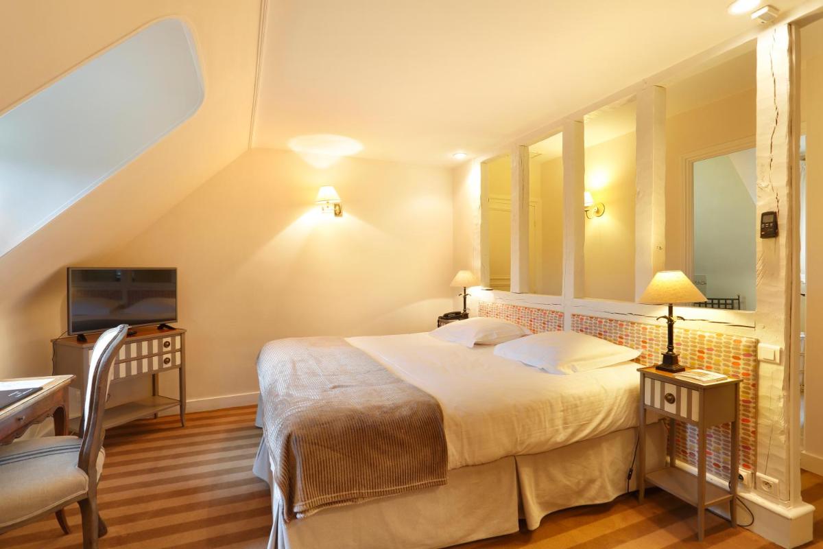 Un ou plusieurs lits dans un hébergement de l'établissement Auberge du Bon Laboureur Chenonceaux