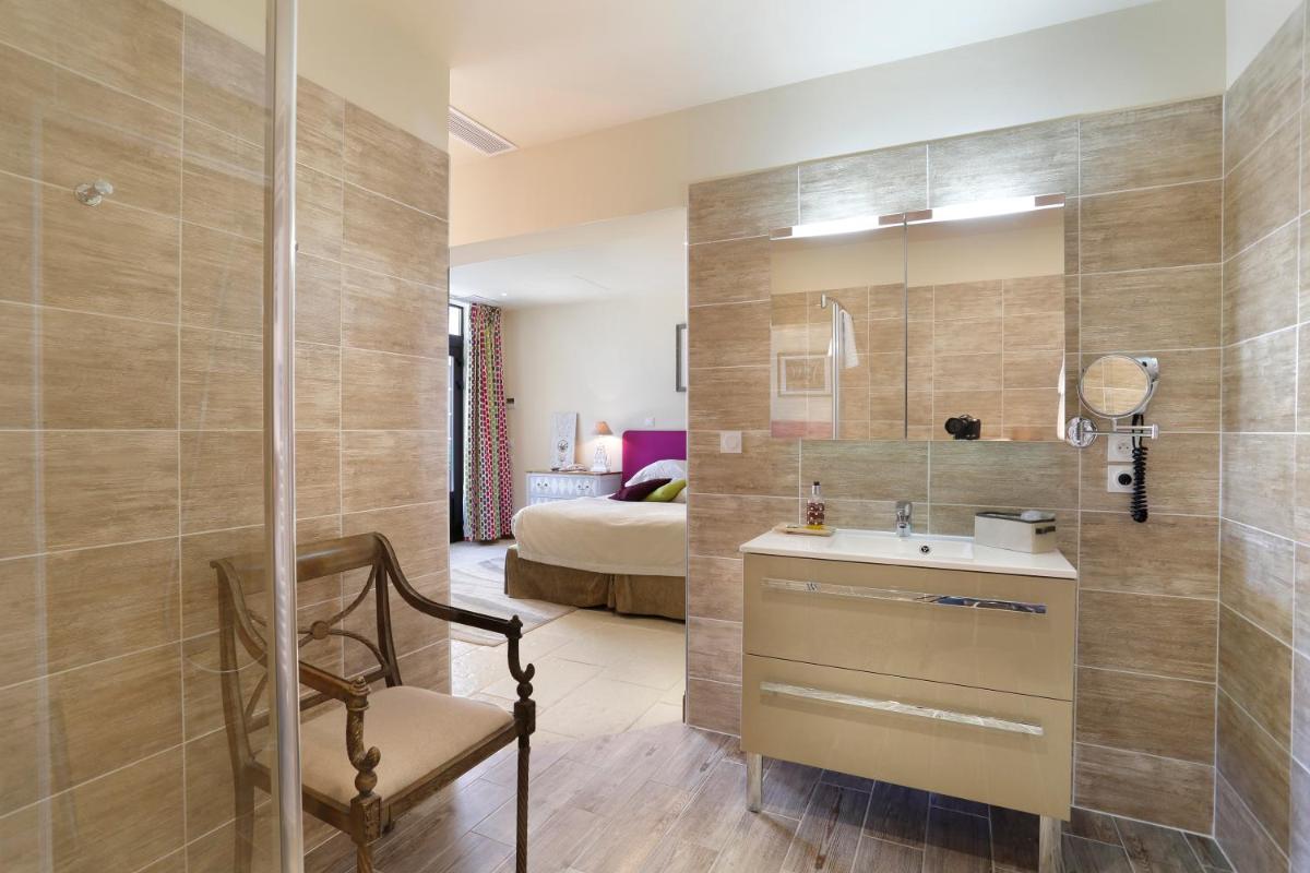 Un ou plusieurs lits dans un hébergement de l'établissement Auberge du Bon Laboureur Chenonceaux
