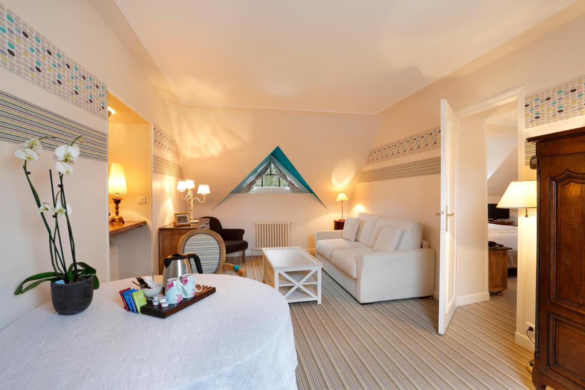 Un ou plusieurs lits dans un hébergement de l'établissement Auberge du Bon Laboureur Chenonceaux