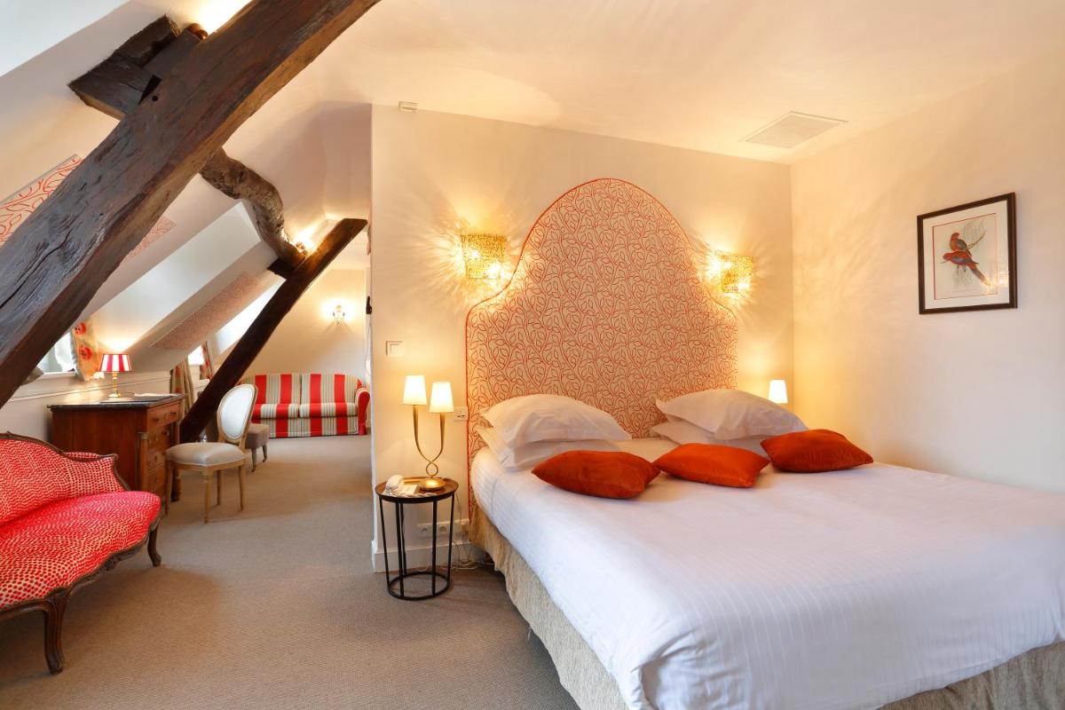 Un ou plusieurs lits dans un hébergement de l'établissement Auberge du Bon Laboureur Chenonceaux