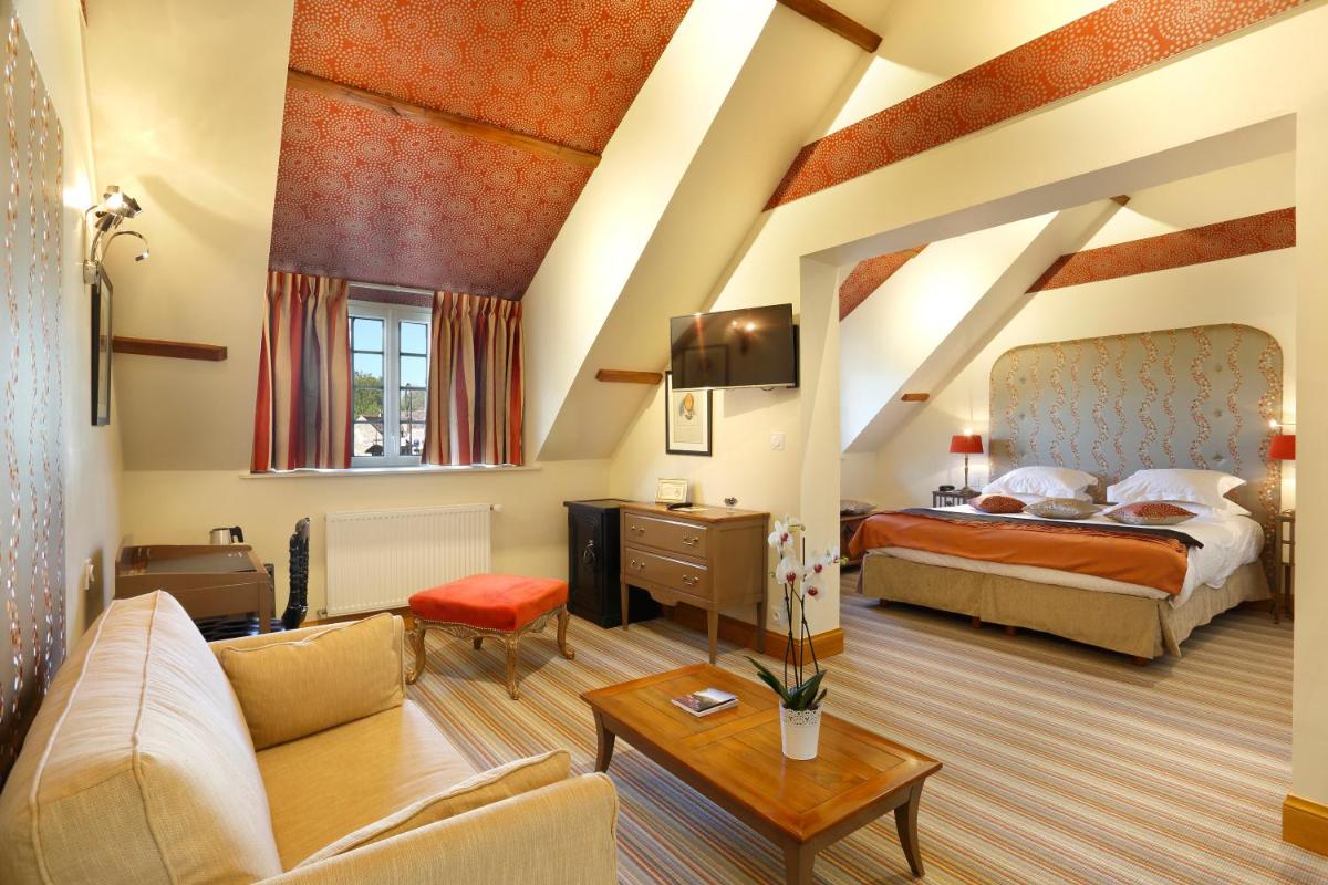 Un ou plusieurs lits dans un hébergement de l'établissement Auberge du Bon Laboureur Chenonceaux