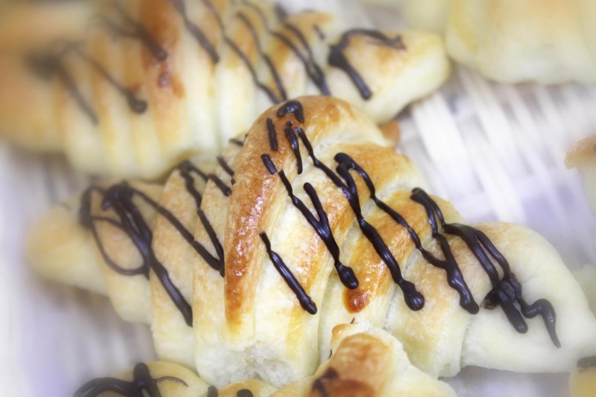 a pastry with chocolate sauce on top of it at Saura Hotel, Agra - A Club Mahindra Associate in Agra