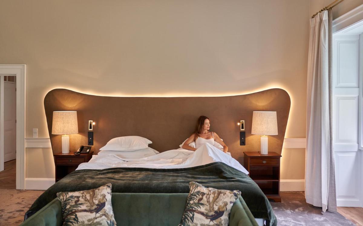Uma cama ou camas num quarto em Casa Velha do Palheiro Relais & Chateaux