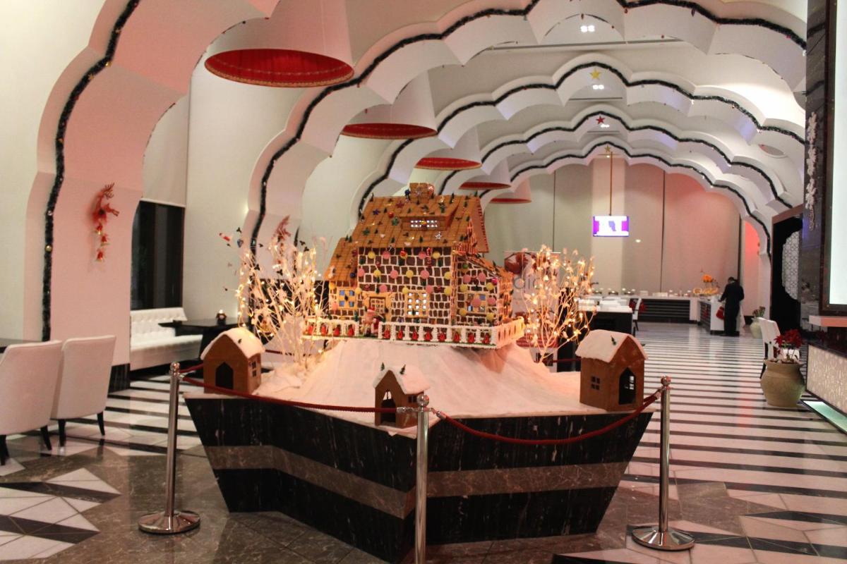 a model of a ship on a table in a room at Saura Hotel, Agra - A Club Mahindra Associate in Agra