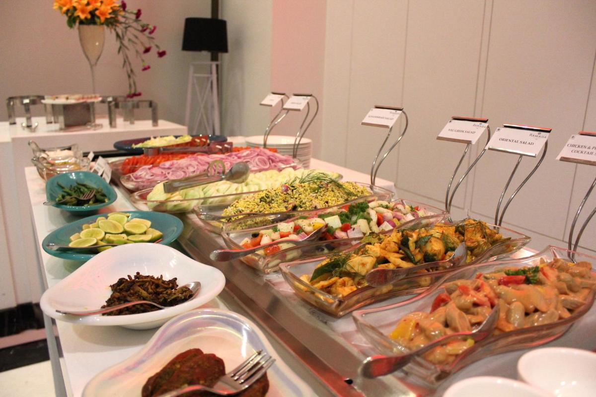 a buffet with many different types of food on a table at Saura Hotel, Agra - A Club Mahindra Associate in Agra