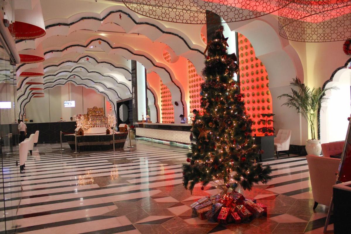 a christmas tree in the middle of a hotel lobby at Saura Hotel, Agra - A Club Mahindra Associate in Agra
