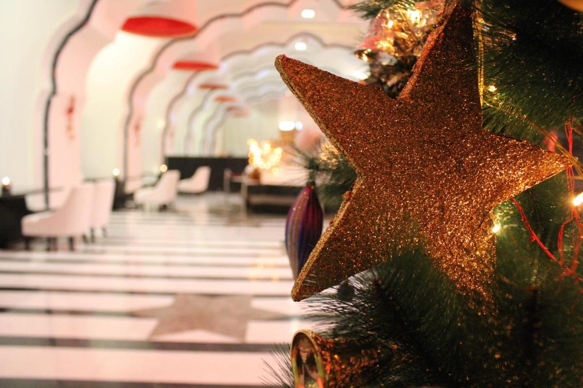 a christmas ornament on a christmas tree in a building at Saura Hotel, Agra - A Club Mahindra Associate in Agra