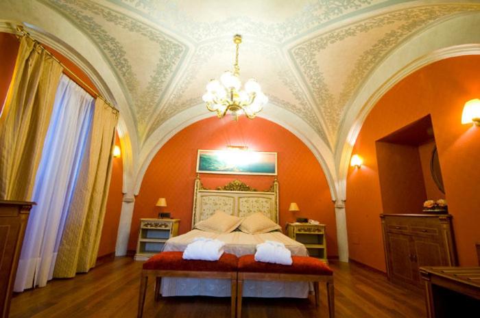 Cama o camas de una habitación en Hotel Palacio de la Magdalena