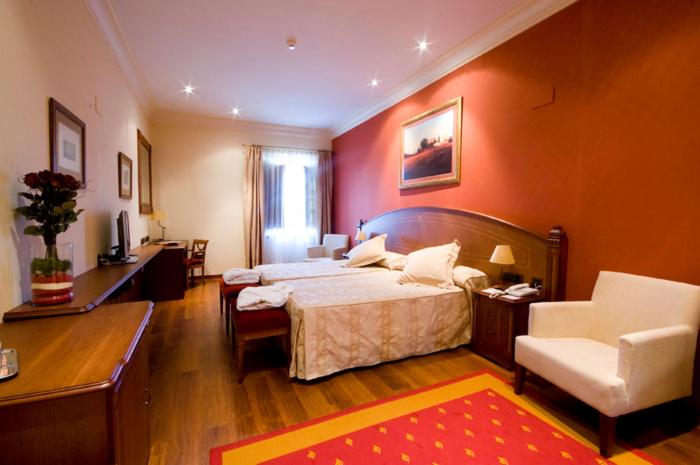 Cama o camas de una habitación en Hotel Palacio de la Magdalena