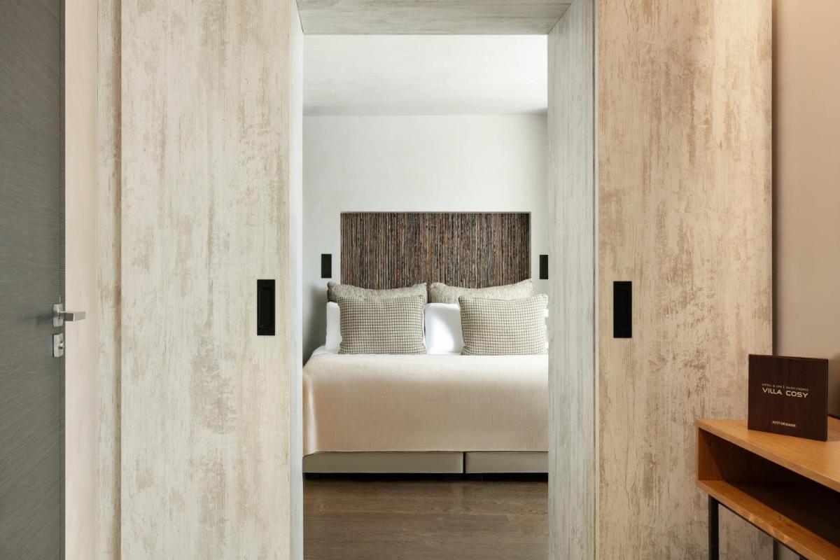 Un ou plusieurs lits dans un hébergement de l'établissement Villa Cosy, hotel & spa