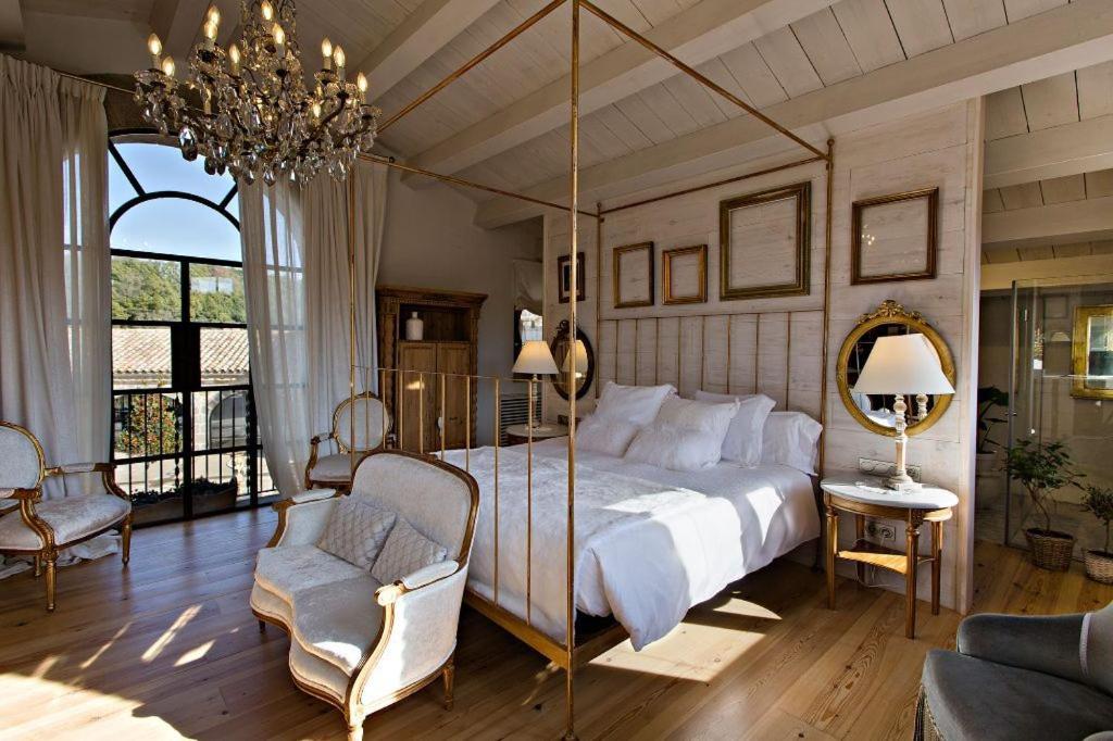 Cama o camas de una habitación en La Vella Farga Hotel