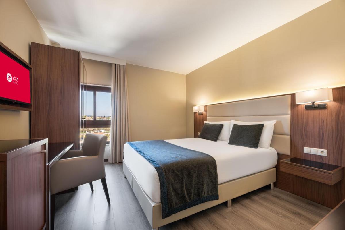 Uma cama ou camas num quarto em Exe São Lázaro