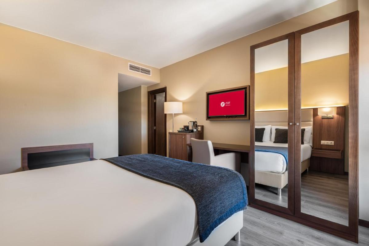 Uma cama ou camas num quarto em Exe São Lázaro