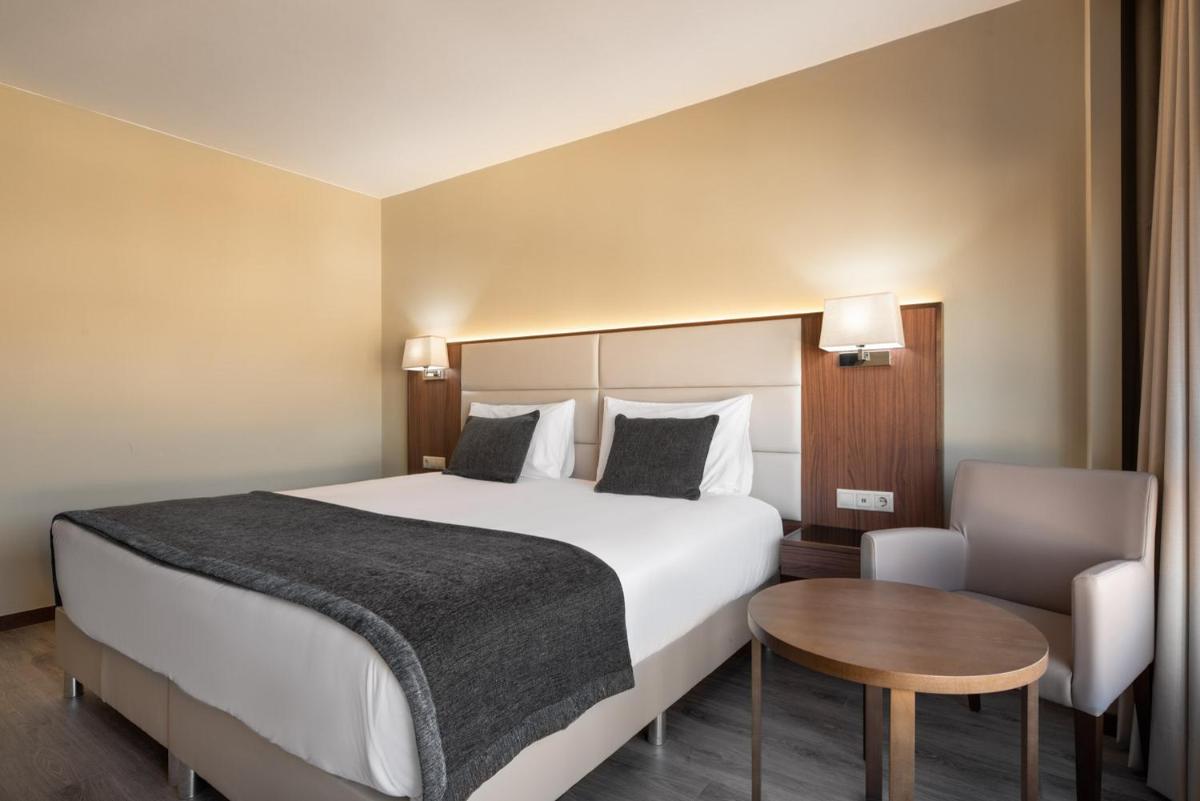 Uma cama ou camas num quarto em Exe São Lázaro