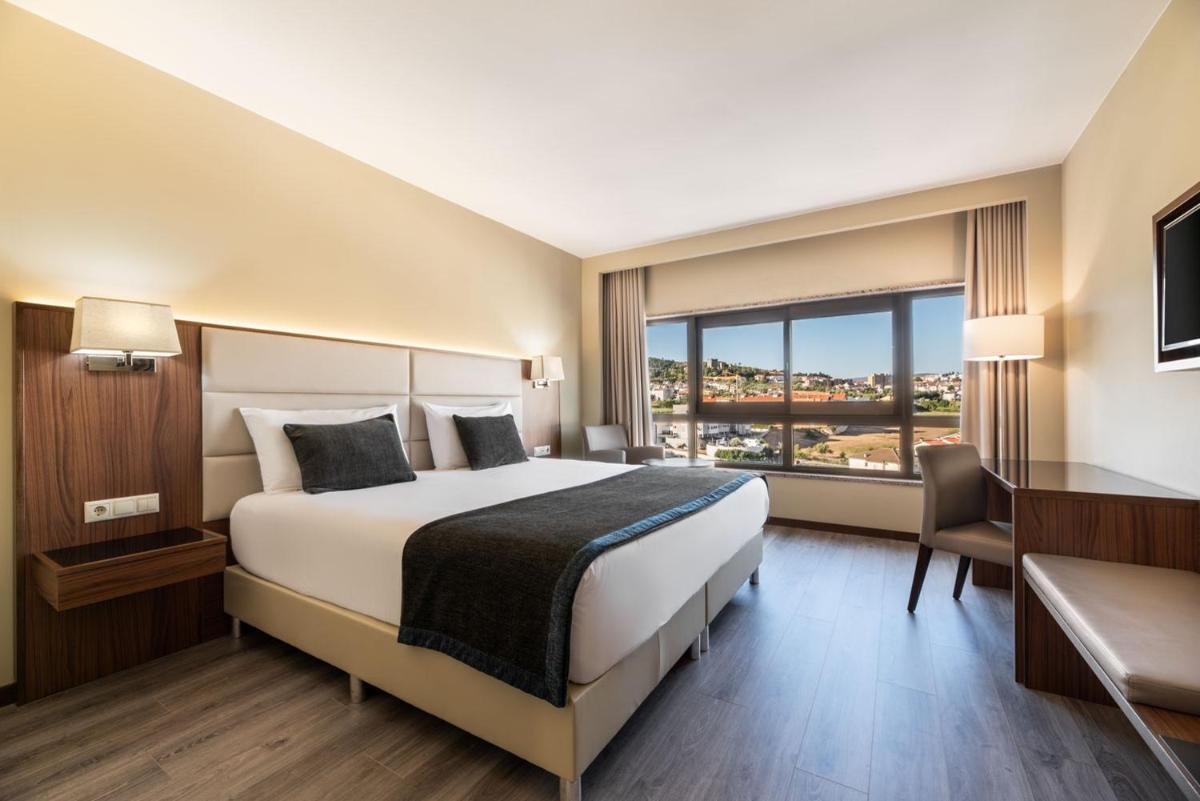 Uma cama ou camas num quarto em Exe São Lázaro