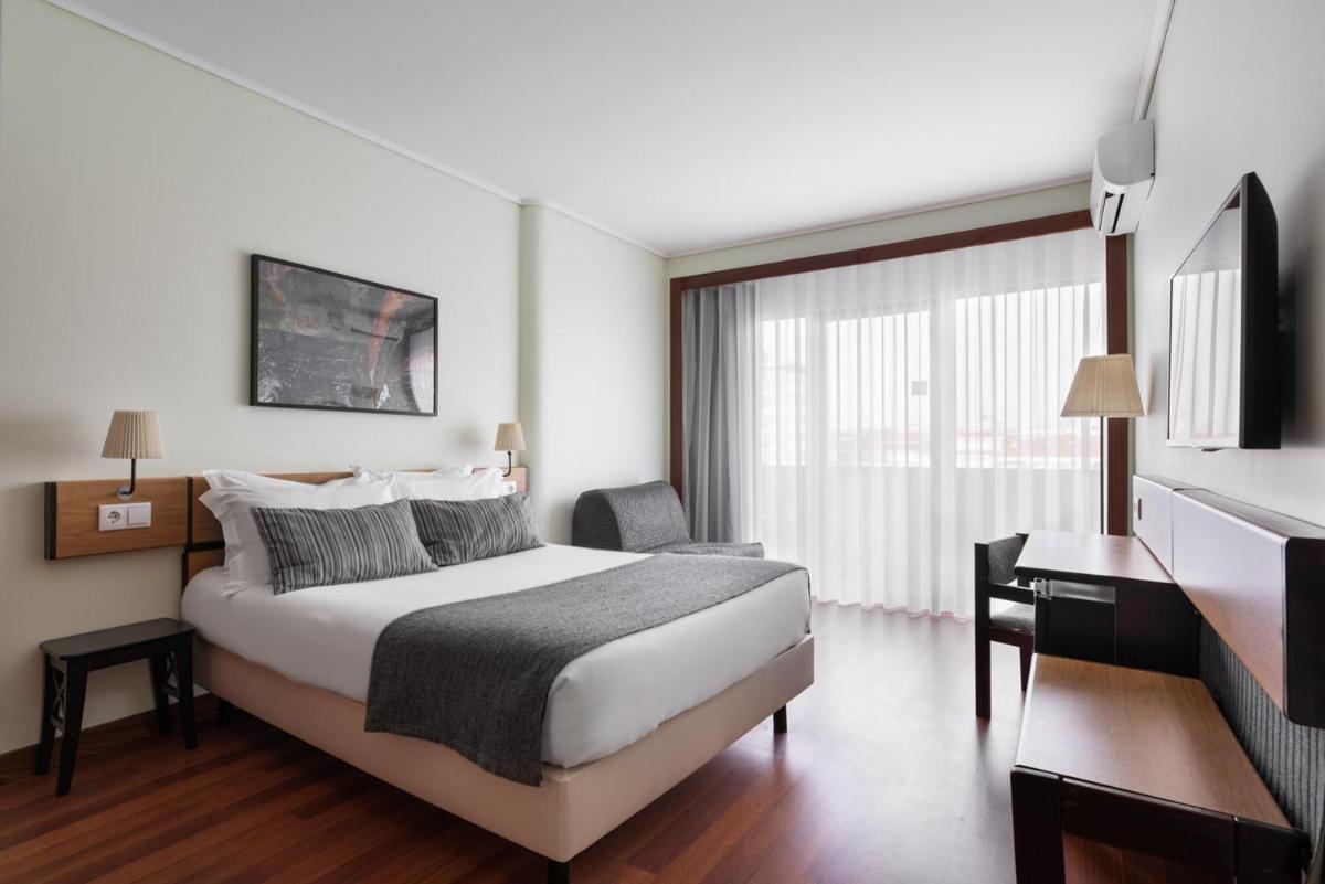 Uma cama ou camas num quarto em Dorma Praia Golfe