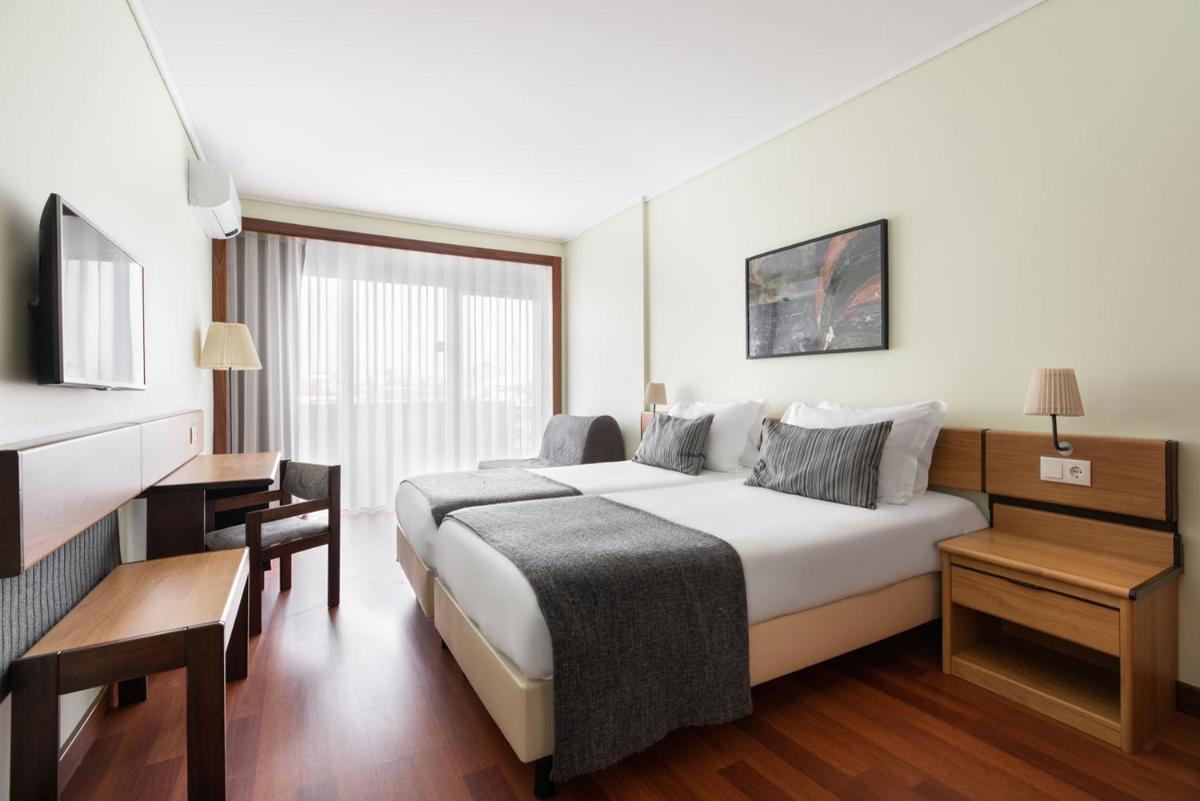 Uma cama ou camas num quarto em Dorma Praia Golfe