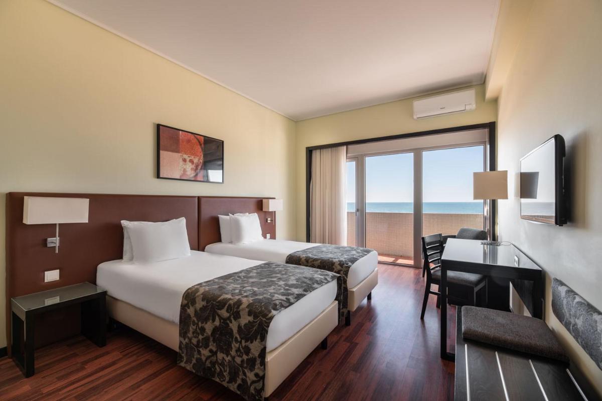 Uma cama ou camas num quarto em Dorma Praia Golfe