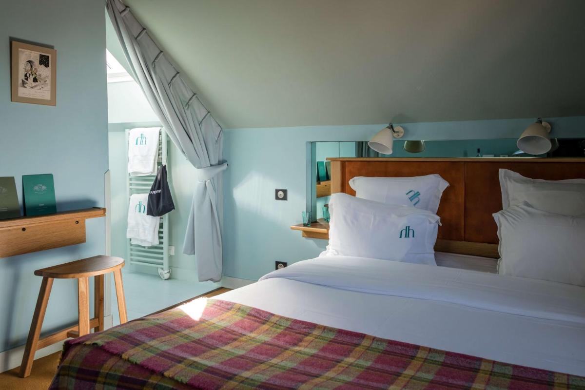 Un ou plusieurs lits dans un hébergement de l'établissement Hôtel Ville d'Hiver