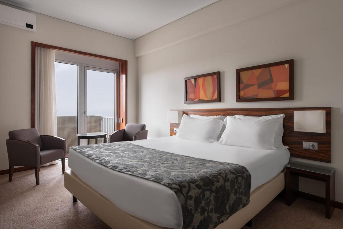 Uma cama ou camas num quarto em Dorma Praia Golfe