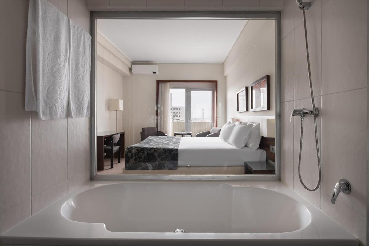 Uma cama ou camas num quarto em Dorma Praia Golfe