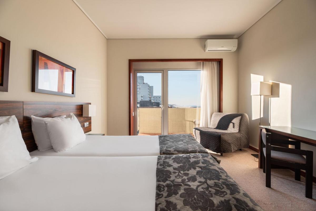 Uma cama ou camas num quarto em Dorma Praia Golfe