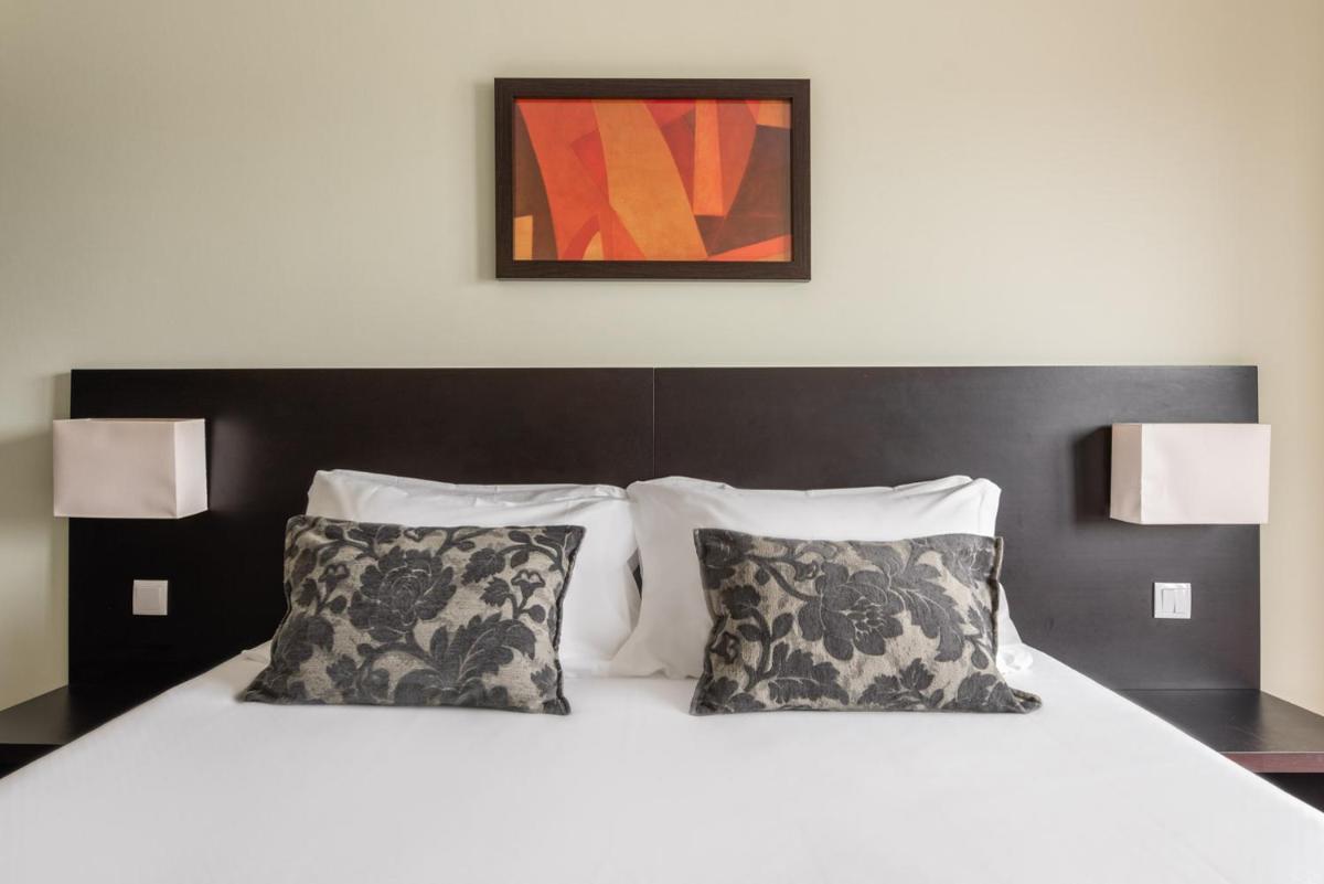 Uma cama ou camas num quarto em Dorma Praia Golfe