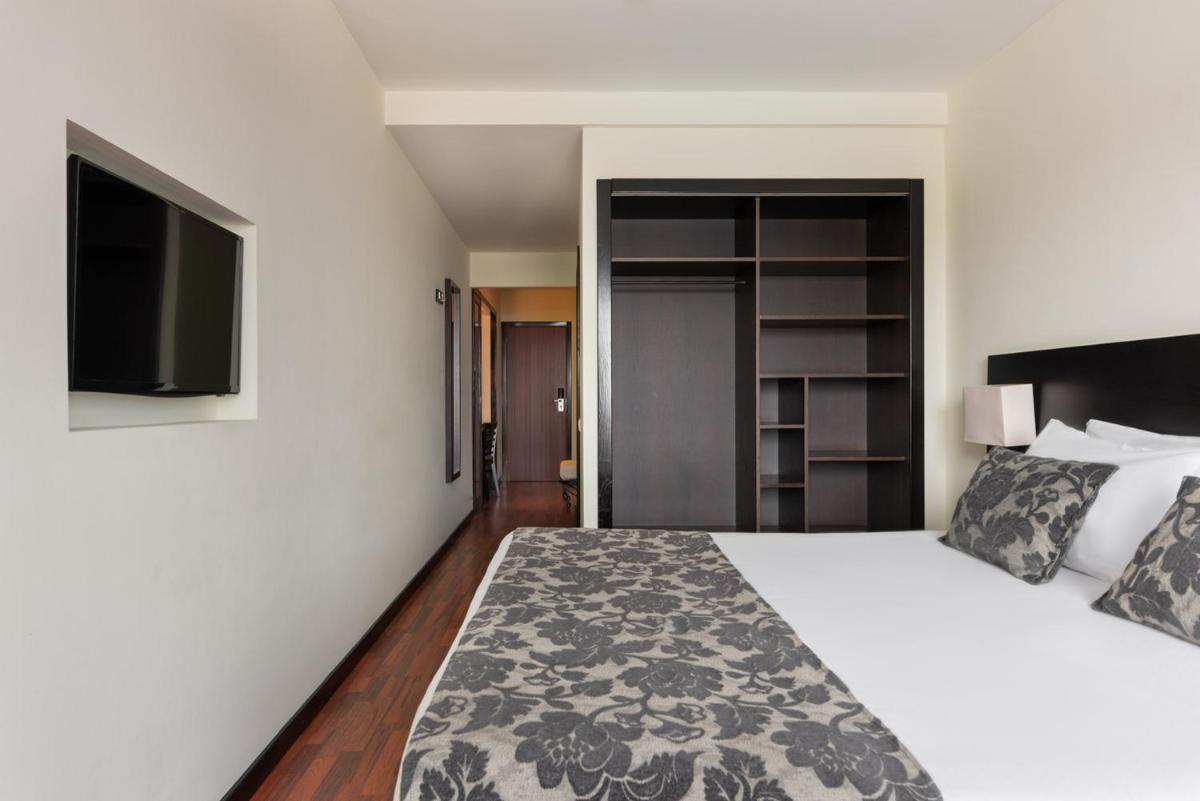 Uma cama ou camas num quarto em Dorma Praia Golfe