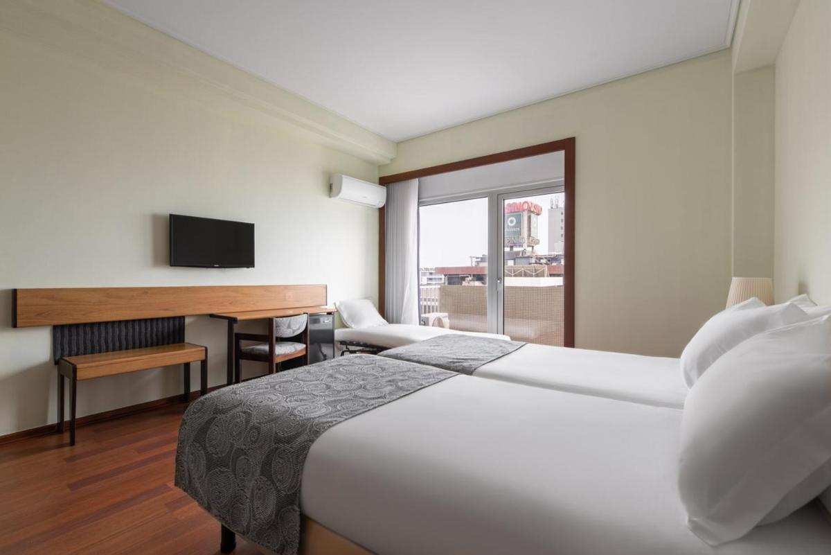 Uma cama ou camas num quarto em Dorma Praia Golfe