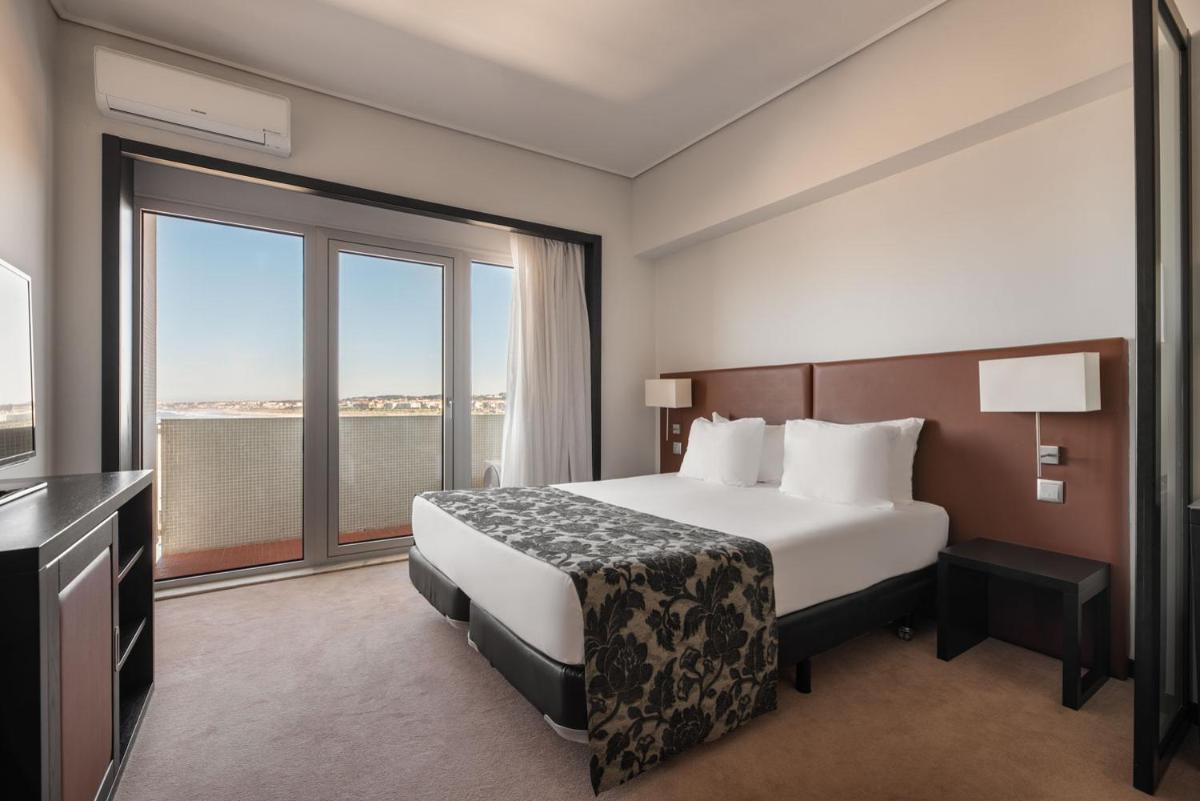 Uma cama ou camas num quarto em Dorma Praia Golfe