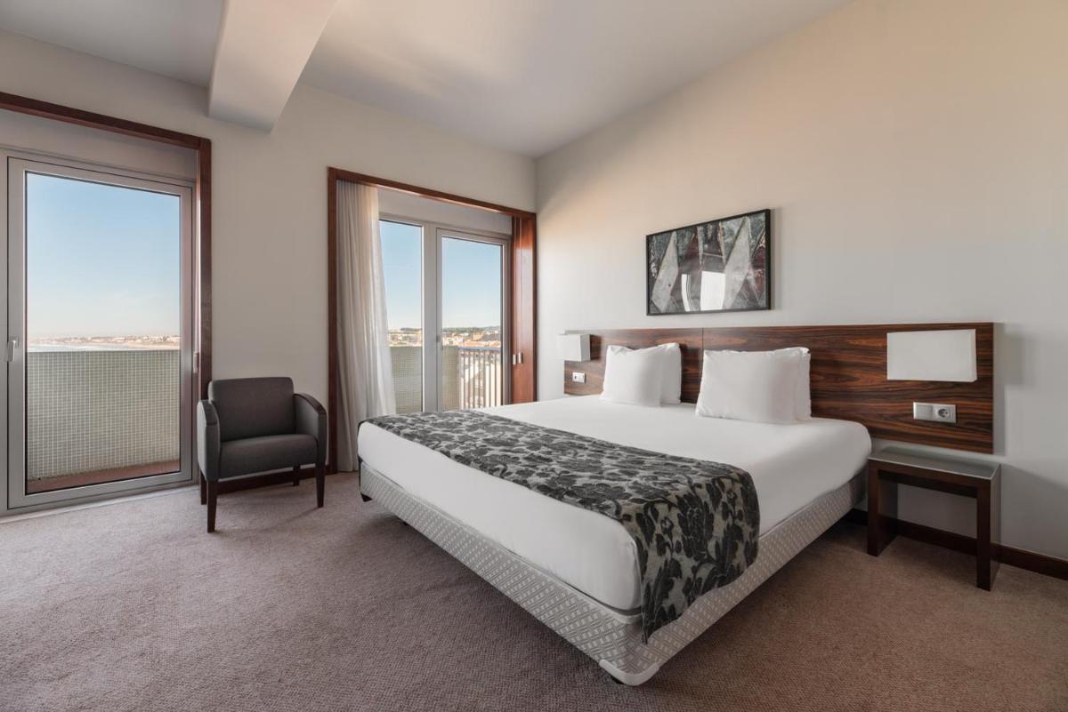 Uma cama ou camas num quarto em Dorma Praia Golfe