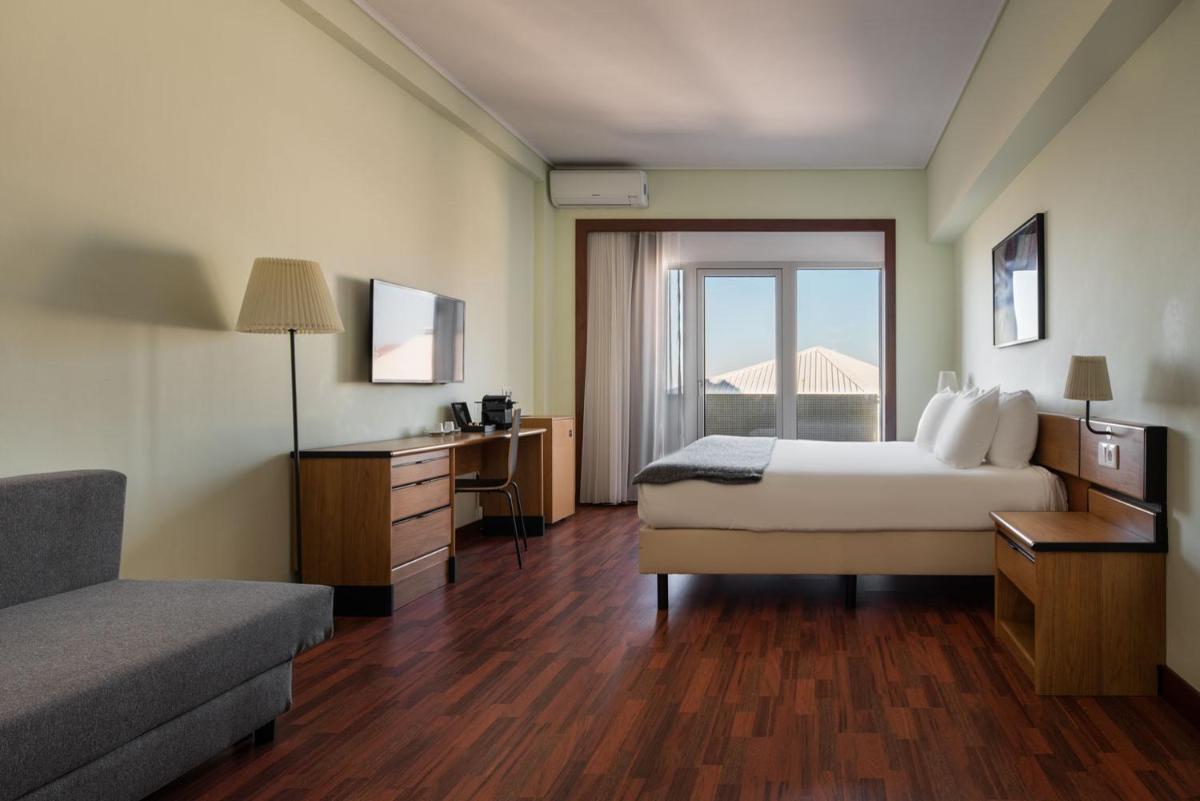 Uma cama ou camas num quarto em Dorma Praia Golfe