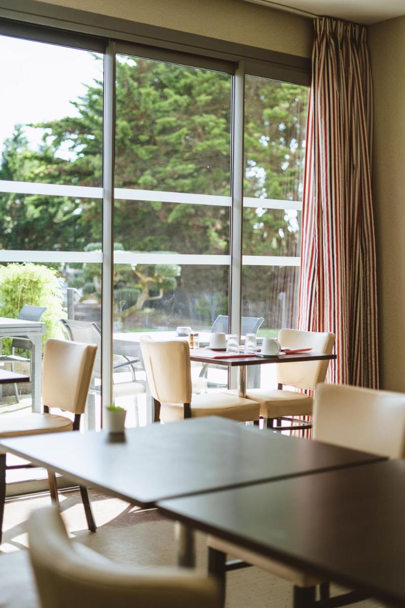 Coin salon dans l'établissement Le Galet Hotel & Spa