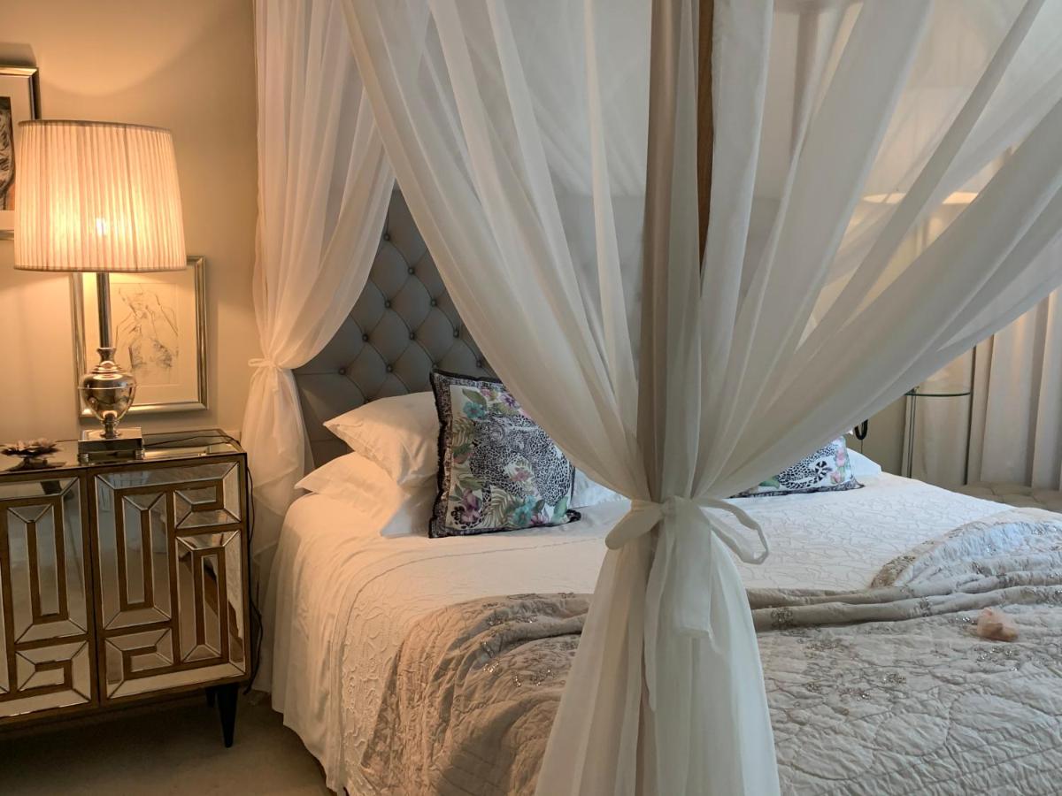 Uma cama ou camas num quarto em Carmo's Boutique Hotel - Small Luxury Hotels of the World