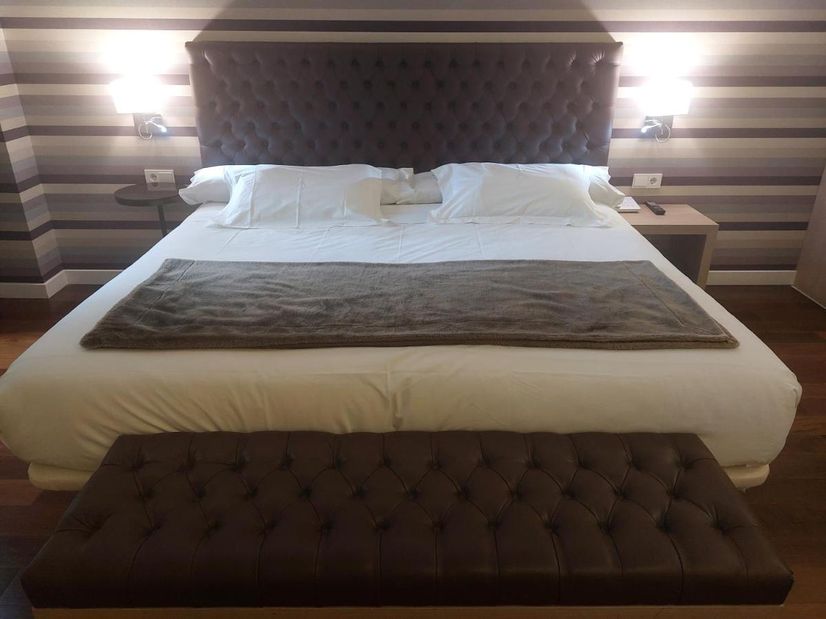 Cama o camas de una habitación en U-Hotel Spa Ciudad de Astorga