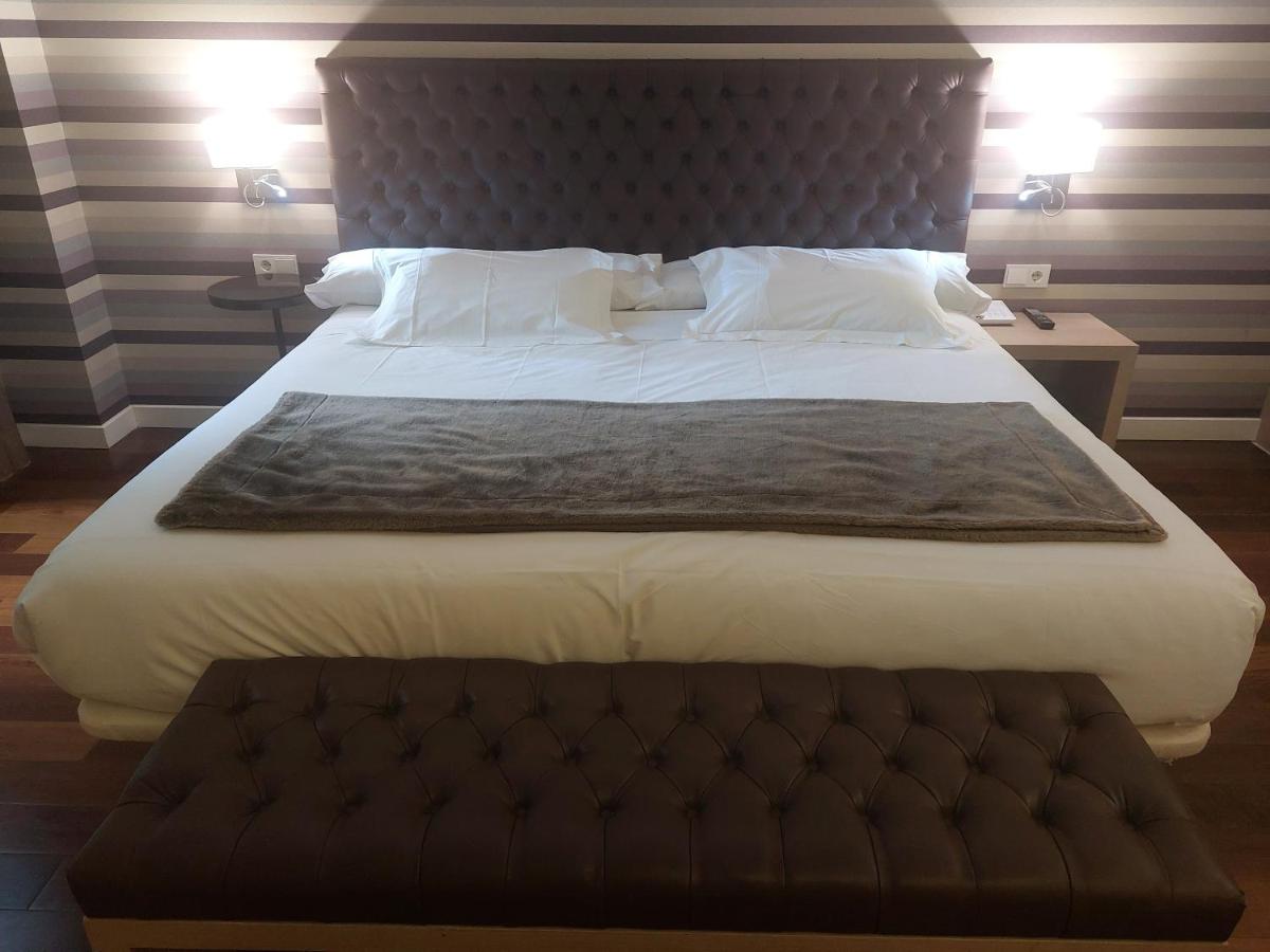 Cama o camas de una habitación en U-Hotel Spa Ciudad de Astorga