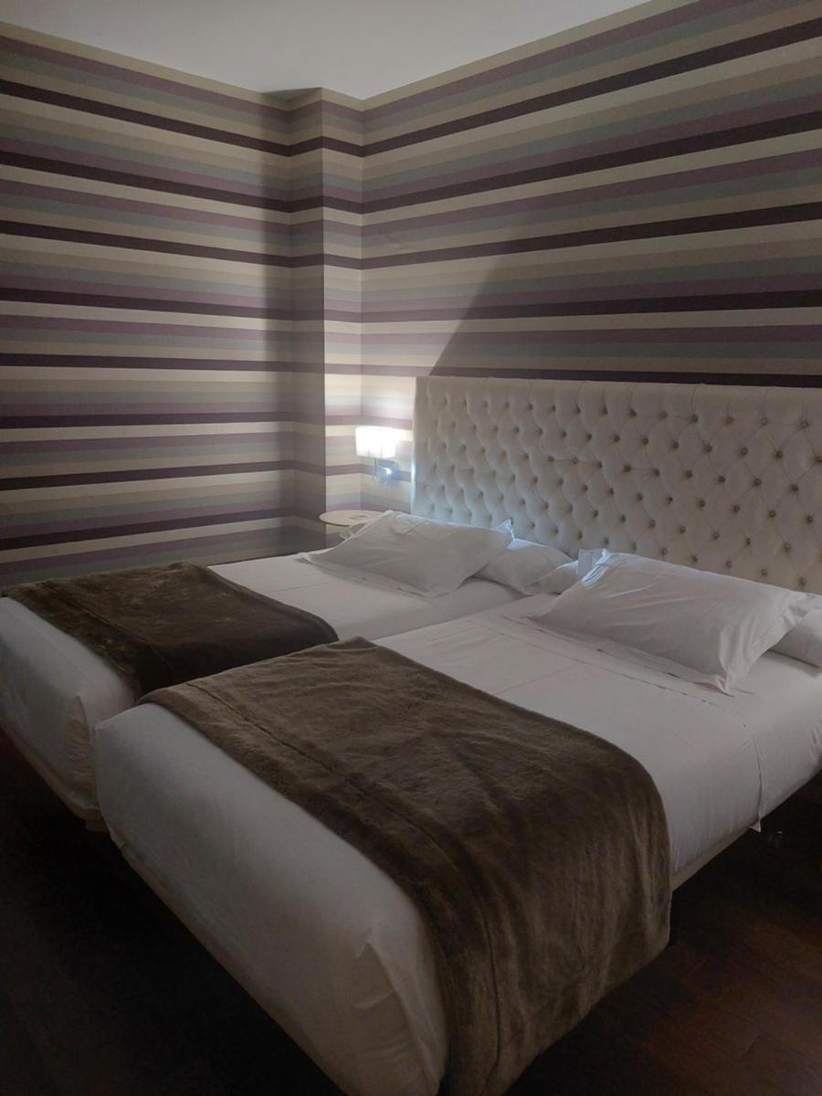 Cama o camas de una habitación en U-Hotel Spa Ciudad de Astorga